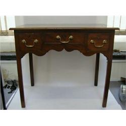 A MAHOGANY LOWBOY, c.1780, moulded edge top, central frieze drawers flanked by two deeper oak lin