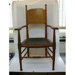 AN ARTS AND CRAFTS OAK ARMCHAIR, c.1900, design attributed to William Birch, shaped splat between