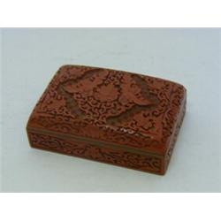 AN ORIENTAL CARVED LAQUER CASKET, 20th Century, iron red, brass rim, 15cm x 10cm  30-50