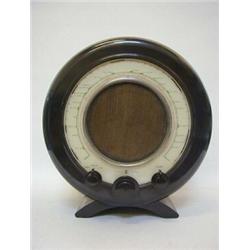 AN EKCO BLACK BAKELITE RADIO MODEL A22, c.1946, originally designed by Wells Coates c.1932, of ci