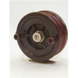 A BAKELITE ALPHA FISHING REEL, diameter 10cm  20-30