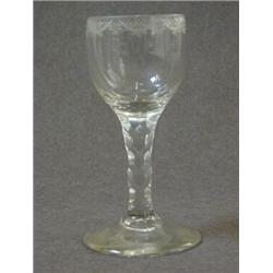 A WINE GLASS, c.1770, ovoid bowl, wheel engraved rim in festoons, facet cut lower section and ste