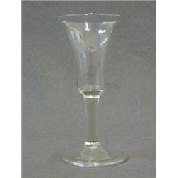 A WINE GLASS, c.1750, bell bowl, drawn stem on folded pontil base, height 16cm  100-120