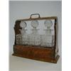 Image 1 : A VICTORIAN OAK TANTALUS gothic brass mounts, three clear facet cut glass decanters/stoppers (s.d