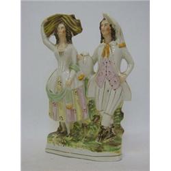 A STAFFORDSHIRE FLATBACK HARVEST FIGURE GROUP, 19th Century, female and male companion, height 32