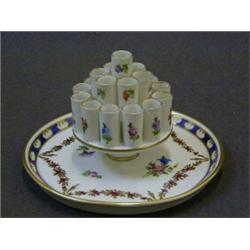 A DRESDEN TABLE CIGARETTE DISPENSER, early 20th Century, polychrome floral sprays, gilt swags and