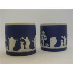 A PAIR OF ADAMS DARK BLUE JASPER DIP CYLINDRICAL VESSELS, c.1900, classical subjects, (s.d.), hei