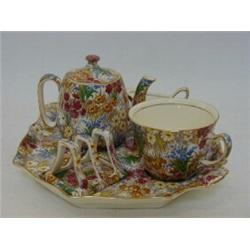 A ROYAL WINTON CHINTZ BREAKFAST SET, 'Marguerite' pattern, teapot, cup (s.d.), cream jug, condime