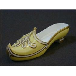 AN ORNAMENTAL SLIPPER, mid 19th Century, (possibly Minton), gilt detailing on a canary yellow gro
