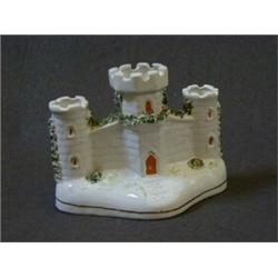 A CERAMIC PASTILLE BURNER, formed as a triple turretted castle, height 11cm  30-40