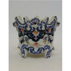 A FAIENCE CACHE POT, Nevers type, blue, olive and iron scrollwork, script mark 'AR', height 11cm