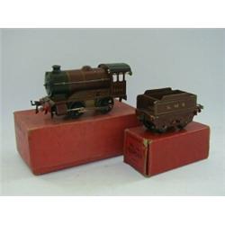A BOXED HORNBY TRAINS 0-4-0 LOCOMOTIVE AND TENDER, N.5600, LMS, clockwork, with five headlamps an