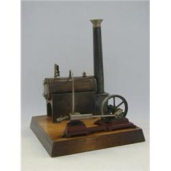 A GERMAN STATIONARY STEAM ENGINE, (possibly Carette c.1905), wooden plinth, 19cm x 19cm  100-120
