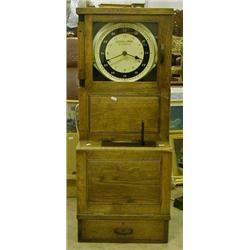 An oak cased 1930's Gledhill Brook Time Recorder, used until 1990 by the Blackpool transport Co (