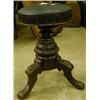 Image 1 : A stained beech swivel piano stool on tripod carved foot £70-90