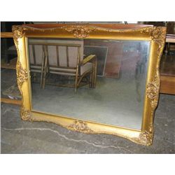 Vintage gold tone framed mirror.