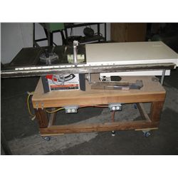 Electric built in table saw and bench on wheels.