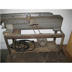 Commercial plainer on metal stand.