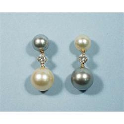 A pair of unusual pearl and diamond "vice ver...