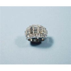 An 18 kt. white gold band ring set with a seq...
