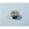 Image 1 : An 18 kt. white gold band ring set with a seq...