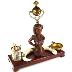 Desk top cigar lighter and holder with ashtray.