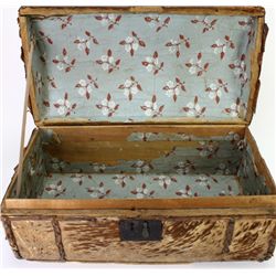 Early tacked leather travel trunk with original