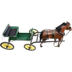 Large hand made wooden buggy and horse.