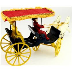 Toy cast iron horse drawn surrey with cloth
