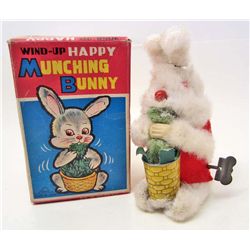 C. 1950S HAPPY MUNCHING BUNNY WIND UP TOY IN BOX
