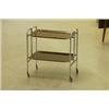 Image 1 : Hopfällbart serveringsbord på hjul, kromad ställning, brickor i palisander, H 68, 41x66. SEK 800-...