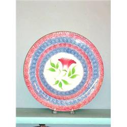 SPATTER BULL'S-EYE SOUP PLATE. Good red and blue bull's-eye rim with a red and green thistle in t…