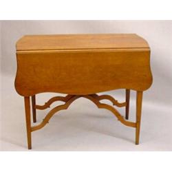HEPPLEWHITE PEMBROKE TABLE. Cherry with a mellow refinishing. Tapered legs and unusual arched and…