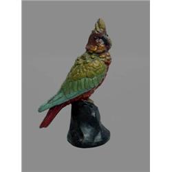 CAST IRON PARROT DOOR STOP. Original red body and yellow, green and blue wings. Minor wear. 12"h.…