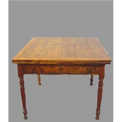 COUNTRY TABLE WITH EXTENSION LEAVES. From Wisconsin. Refinished cherry. Turned legs with a doveta…