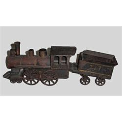 TOY LOCOMOTIVE AND TENDER. Worn orginal black paint with gold detail. Wood and sheet steel with c…
