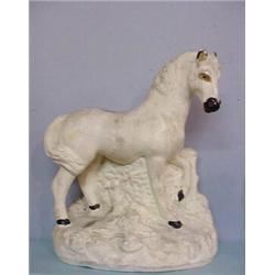 CHALK HORSE. Alert white horse with painted black hooves and muzzle and tan eyes and ears. Minor …