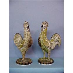 PAIR OF CHALK ROOSTERS. Solid figures with freestanding legs. Handpainted in greens, yellow, and …