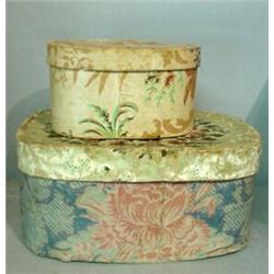 TWO WALLPAPER BAND BOXES. Larger has blue and pink roses on the base, green and brown flowers on …