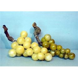 TWO LARGE BUNCHES OF STONE GRAPES. Grapevine stems with ivory and green grapes. Minor wear. 14"l.…