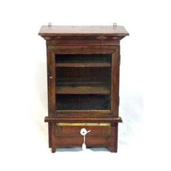 MINIATURE DECORATED CUPBOARD. Pine with old gold striping over a red ground. Short shaped bracket…