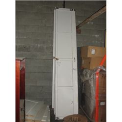 GARAGE DOOR WITH ACCESSORIES INCLUDING 2 MOTORS AT BACK OF BUILDING