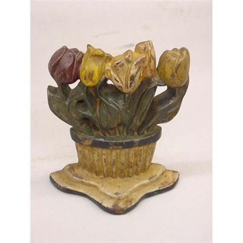 CAST IRON DOOR STOP. Art deco pot of tulips. Ribbed flower pot in white