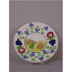 STICK SPATTER PLATE. Floral border in red, cobalt, and green with a center transfer of rabbits an…