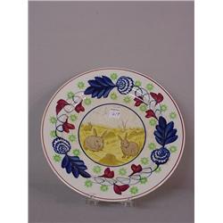 STICK SPATTER PLATE. Floral border in red, cobalt, and green with a rabbit transfer center with y…