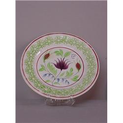 TWO STICK SPATTER PLATES. Green spatter border with a central design of purple columbine with red…