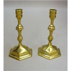 PAIR OF WILLIAM AND MARY CANDLESTICKS. Heavy, polished brass. Domed hexagonal bases with paneled …