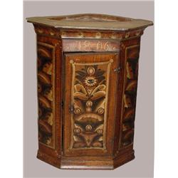 EARLY HANGING CUPBOARD WITH PAINTED DECORATION. Pine with old green, red, white, and black floral…