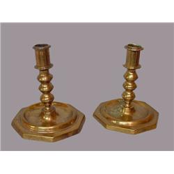 TWO SIMILAR EARLY BRASS CANDLESTICKS. Three bulb stem and octagonal bases. Bases have a split and…
