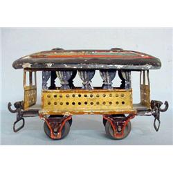 TIN MARKLIN TRAIN CAR. Open passenger car in original pale yellow paint with blue curtains and a …
